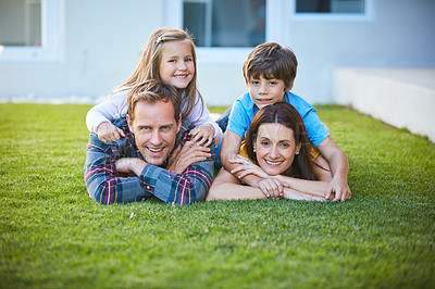 Buy stock photo Shot of a family of four spending time outdoors