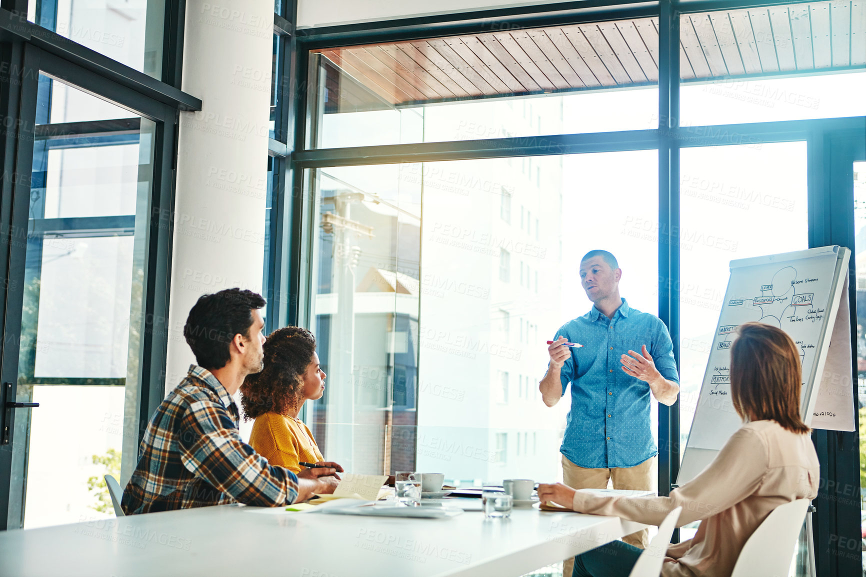 Buy stock photo Business people, man and presentation in conference room with discussion for company growth and common goals. Speaker, employee and meeting in boardroom with teamwork on corporate project and sales