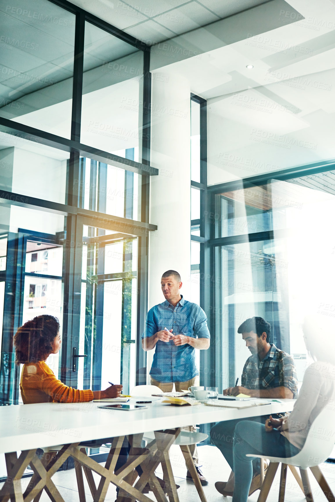 Buy stock photo Cropped shot of a young businessman giving a presentation in the boardroom