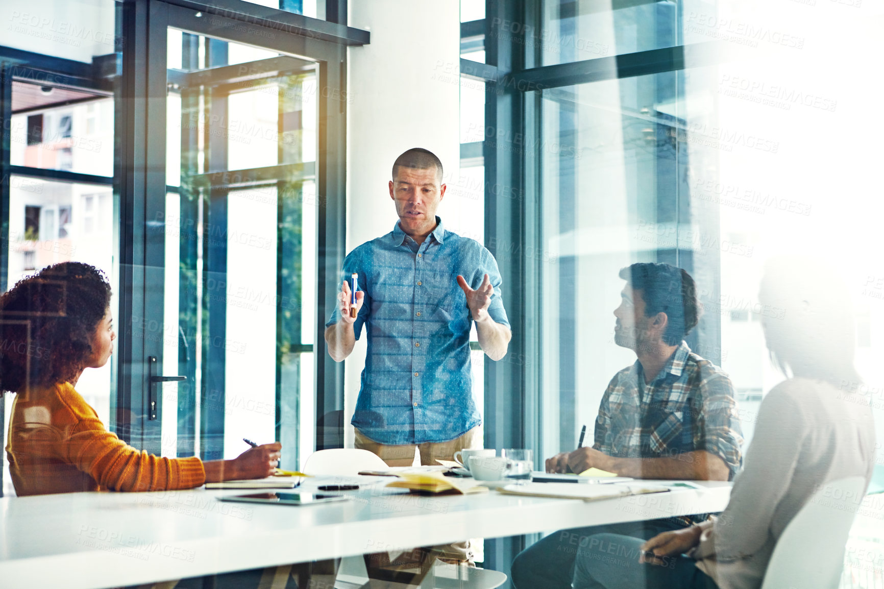 Buy stock photo Cropped shot of a young businessman giving a presentation in the boardroom