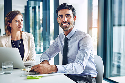 Buy stock photo Portrait of a corporate businessman working with a colleague in an office