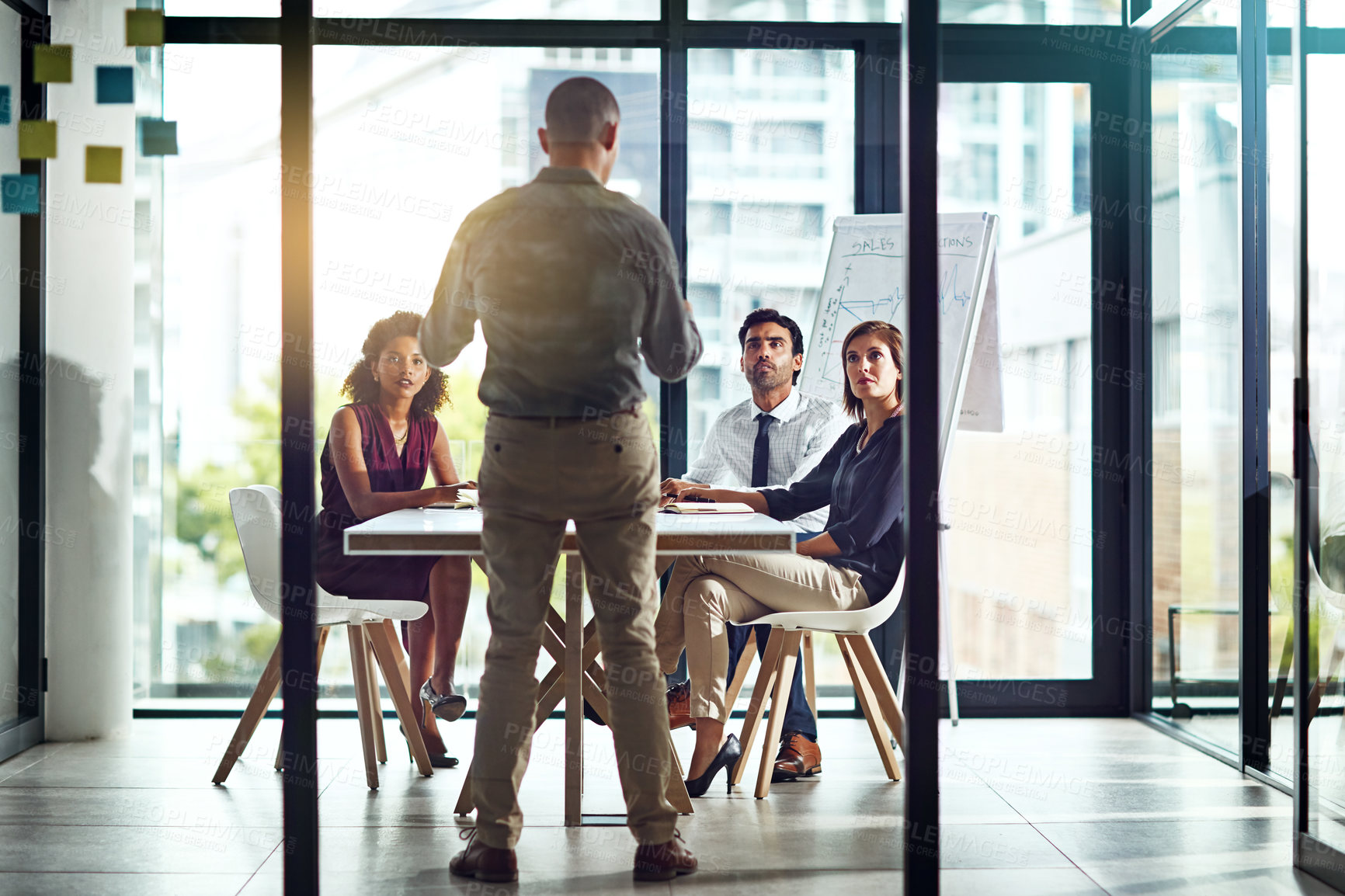 Buy stock photo Shot of a group of colleagues having a meeting in a modern office