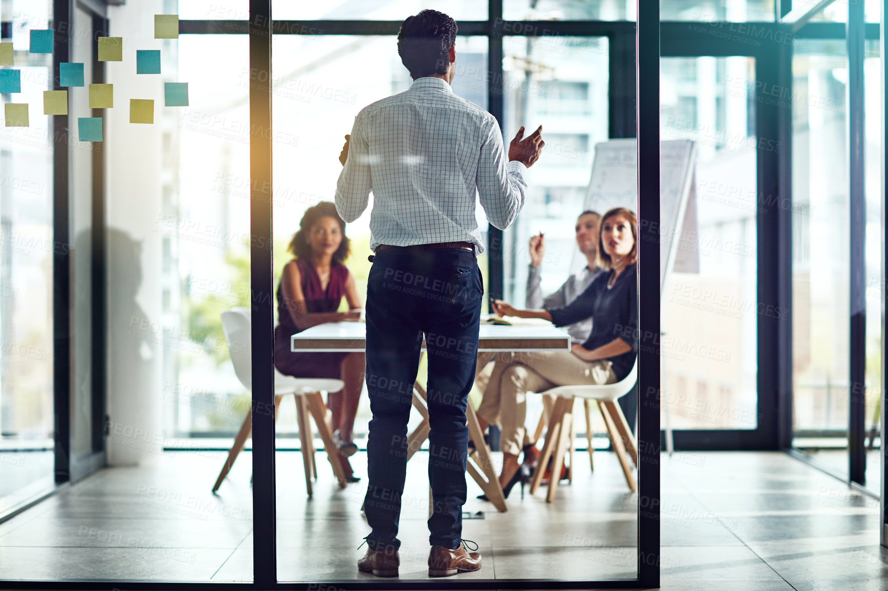 Buy stock photo Shot of a group of colleagues having a meeting in a modern office