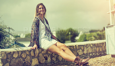 Buy stock photo Shot of a free spirited young woman enjoying the sunshine outside