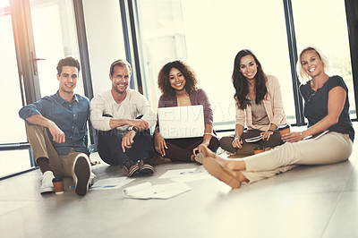 Buy stock photo Portrait of a team of designers brainstorming on the floor in an office