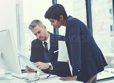 Buy stock photo Shot of a businesswoman and businessman collaborating on a project at work