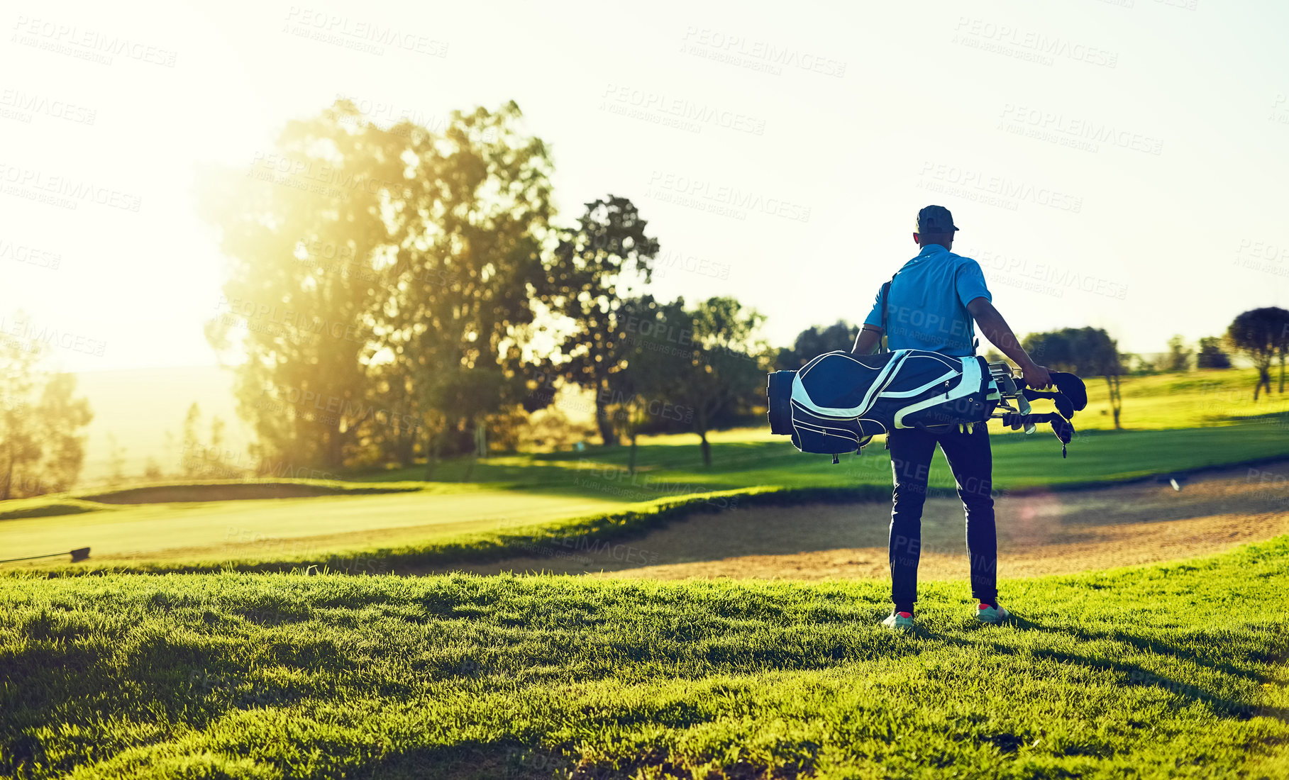 Buy stock photo Shot of a young man playing golf