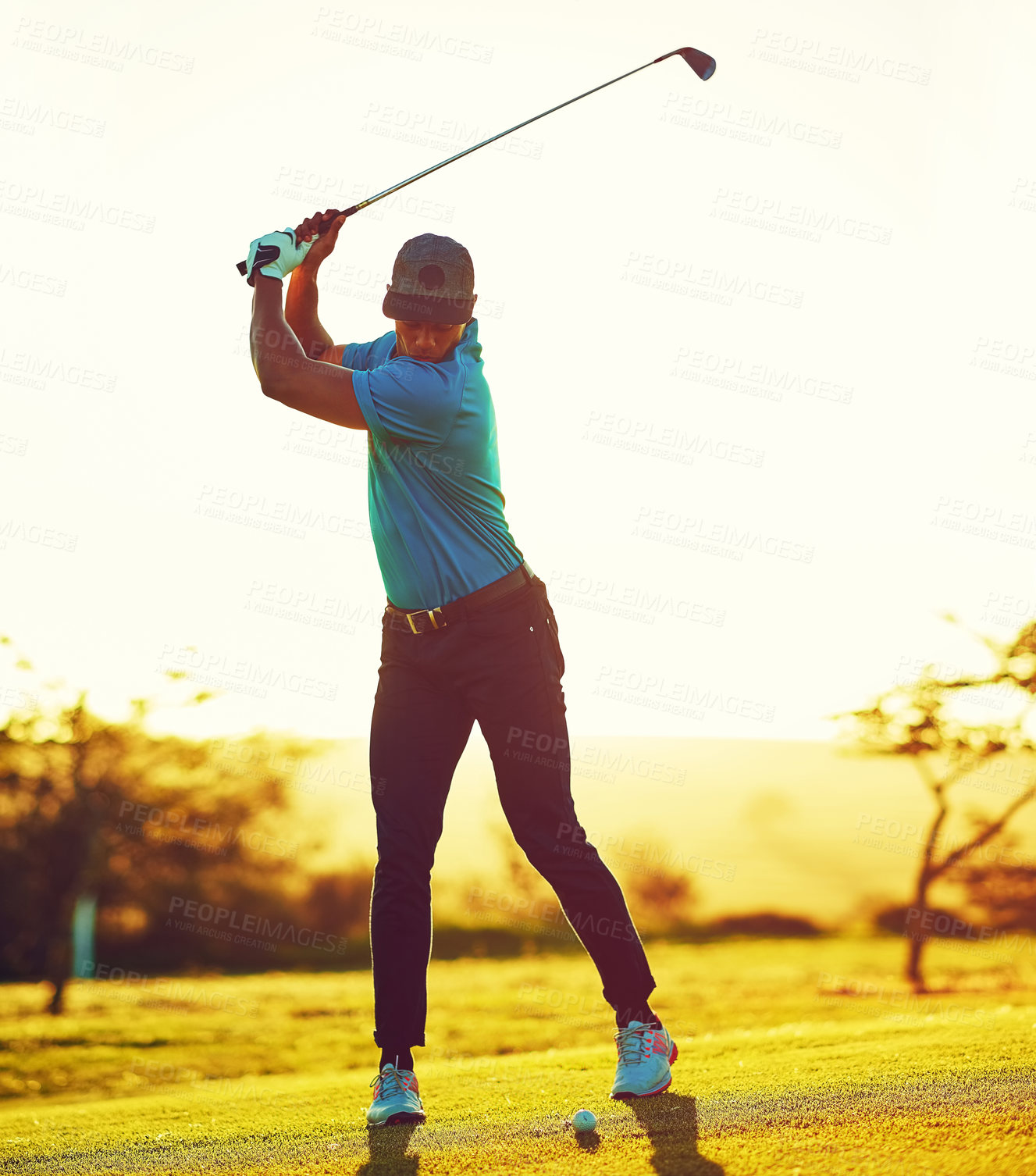 Buy stock photo Shot of a young man playing golf