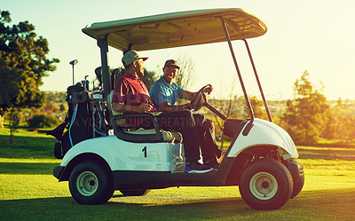 Buy stock photo Shot of two men sitting in a cart on a golf course