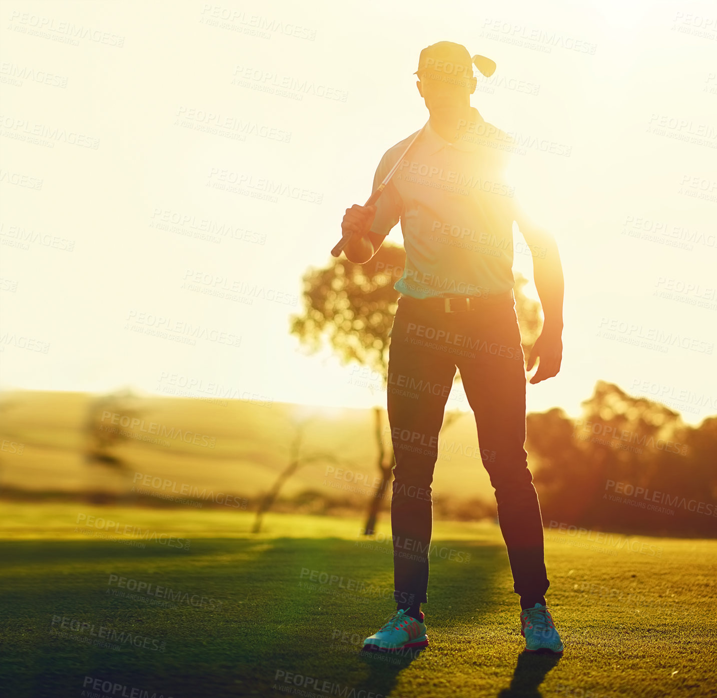 Buy stock photo Shot of a young man playing golf