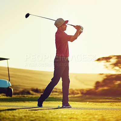 Buy stock photo Shot of a young man playing golf