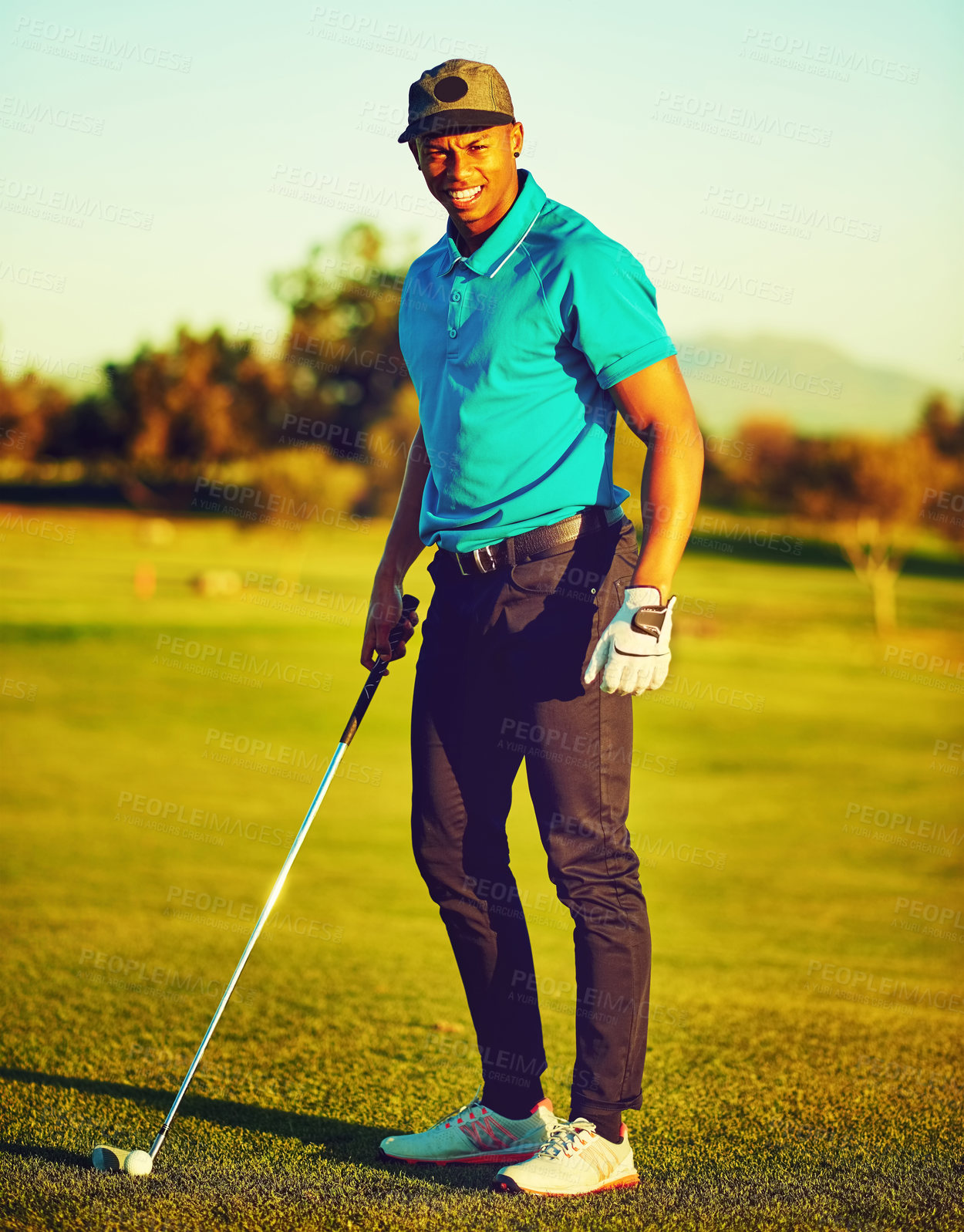 Buy stock photo Shot of a young man playing golf