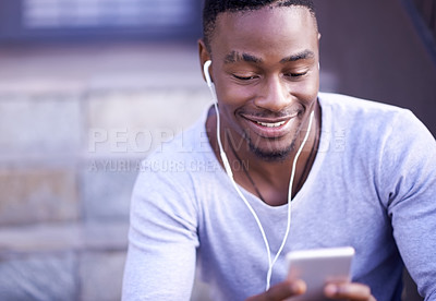 Buy stock photo Happiness, black man and phone with earphones for music, streaming and podcast for relax in city. Male college student, smile and mobile for communication, social media and headphones for audio