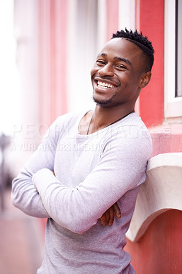 Buy stock photo Outdoor, portrait and black man with smile, city and relax in weekend, break and student in university. Wall, fashion and happy for college in Atlanta, confident and person with pride in street