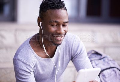 Buy stock photo Student, black man and online in city with tablet for information on university schedule or classes. Male pupil, digital tech and internet with music on college steps, happy and reading ebook on app.