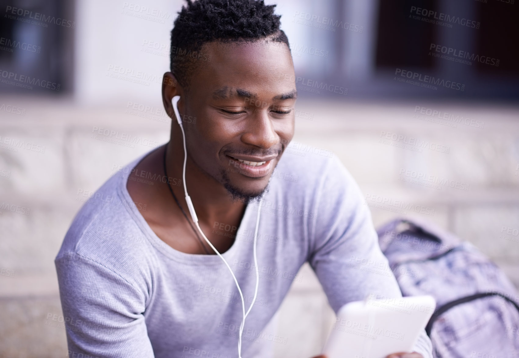 Buy stock photo Student, black man and online in city with tablet for information on university schedule or classes. Male pupil, digital tech and internet with music on college steps, happy and reading ebook on app.