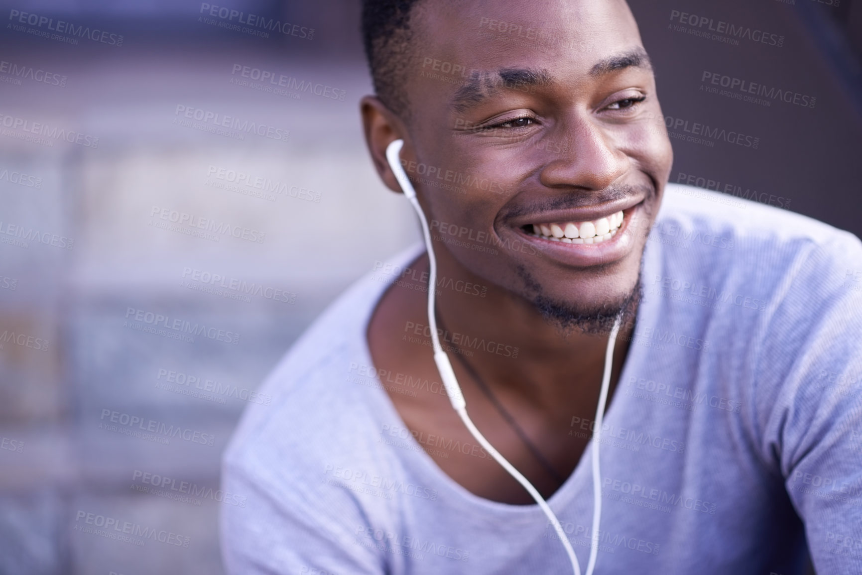 Buy stock photo Black man, smile and earphones for music in city or streaming entertainment, subscription or downtown. Male person, relax and happy for funny podcast with humor in New York or thinking, urban or rest