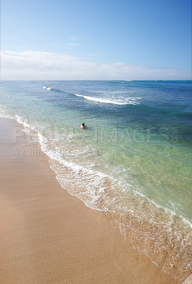 Buy stock photo Swimming, sky and person on beach with waves, sand and tropical holiday for travel getaway in nature. Calm, ocean and tourist in water for island vacation, outdoor adventure and relax in Indonesia