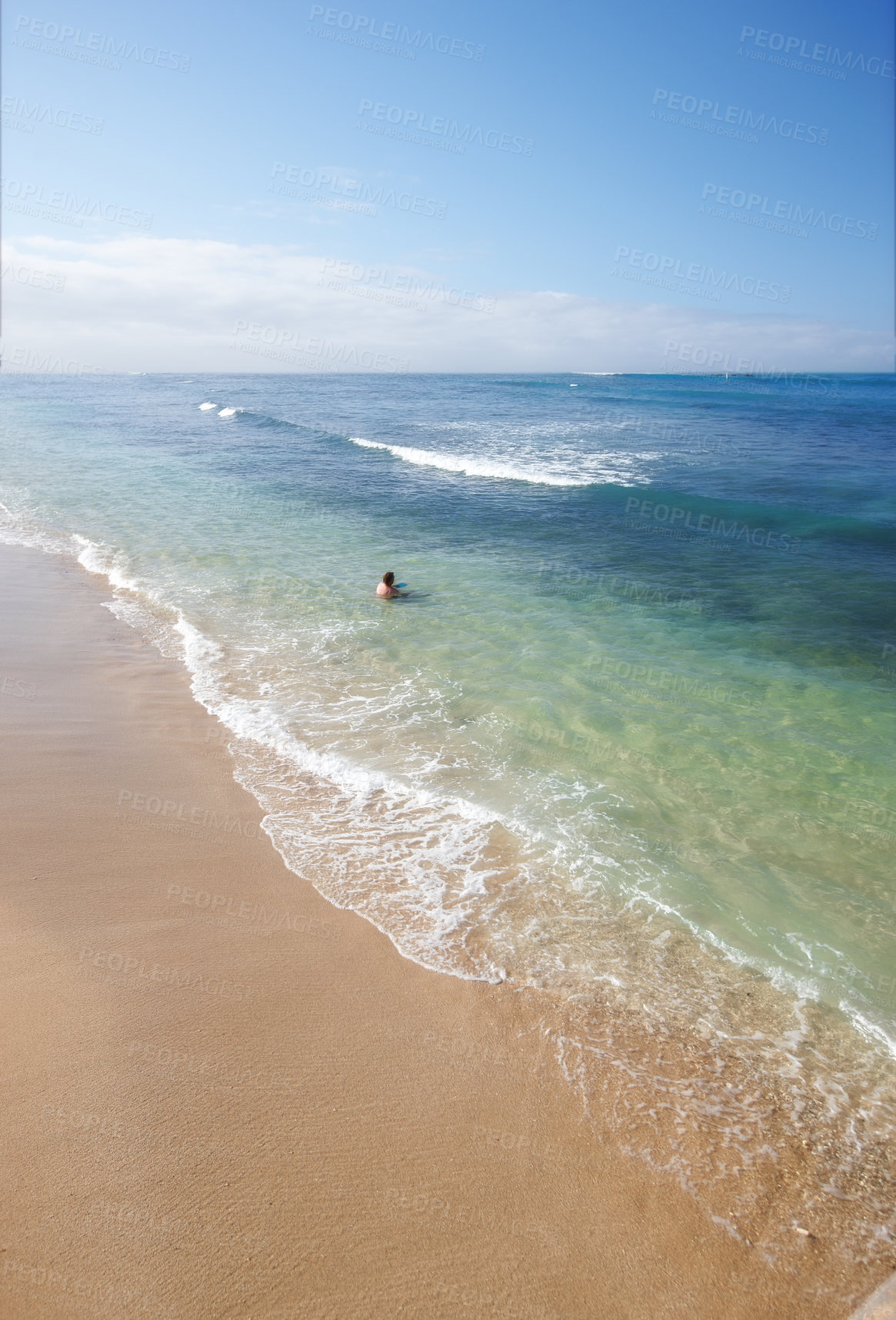 Buy stock photo Swimming, sky and person on beach with waves, sand and tropical holiday for travel getaway in nature. Calm, ocean and tourist in water for island vacation, outdoor adventure and relax in Indonesia