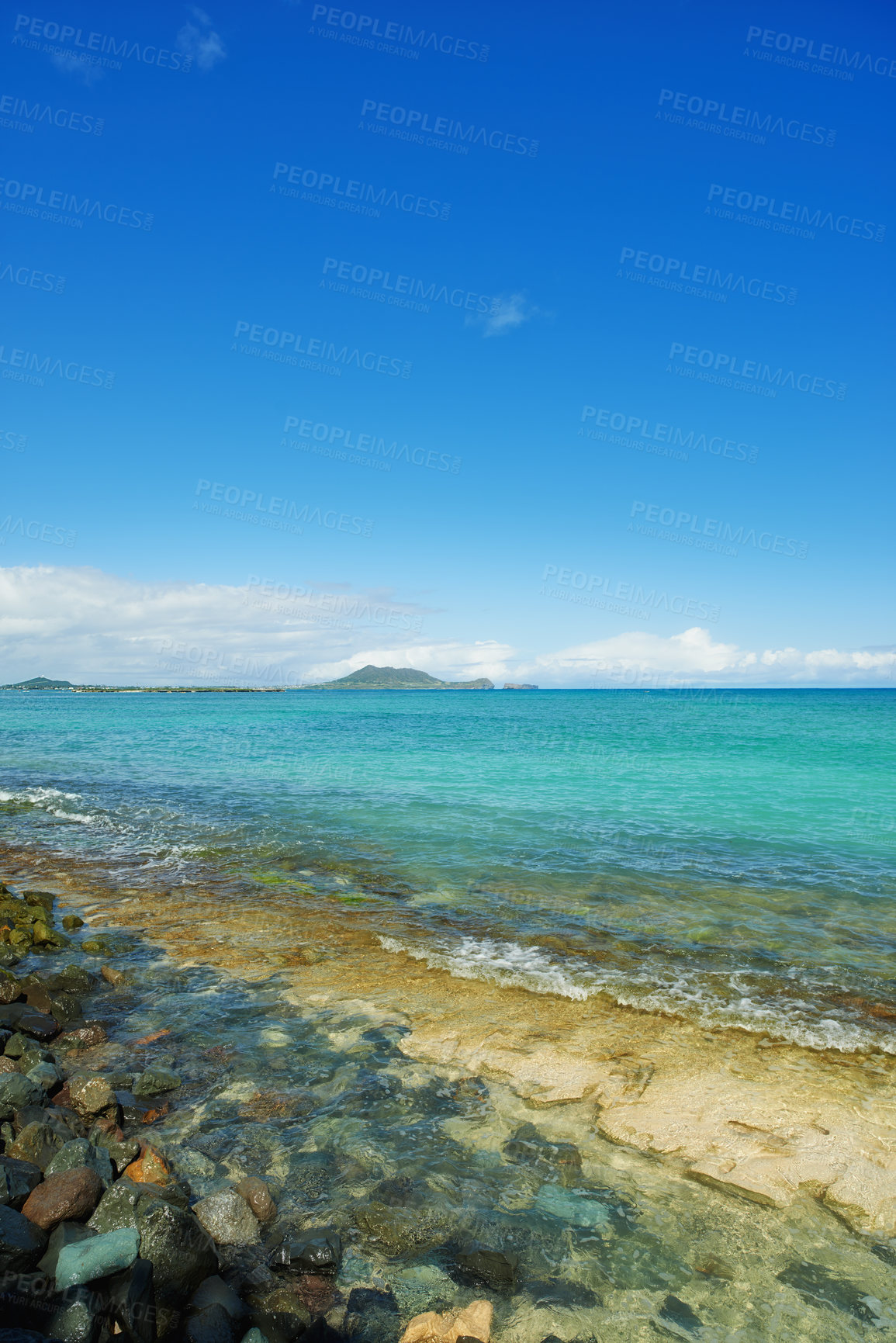 Buy stock photo Island, blue sky and calm beach with coast, rocks and tropical holiday environment for travel getaway in nature. Water, sea and ocean horizon with natural waves for vacation adventure in Indonesia