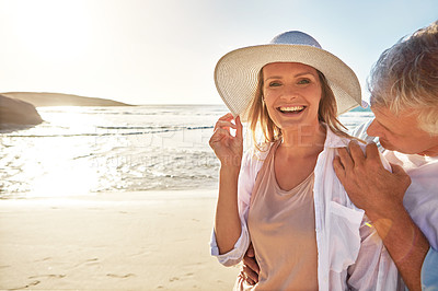 Buy stock photo Mature, portrait and happy couple with beach sunset for love or bonding together in nature. Man, woman or lovers with smile in joy for outdoor sunshine, summer or holiday by water, sea or ocean coast