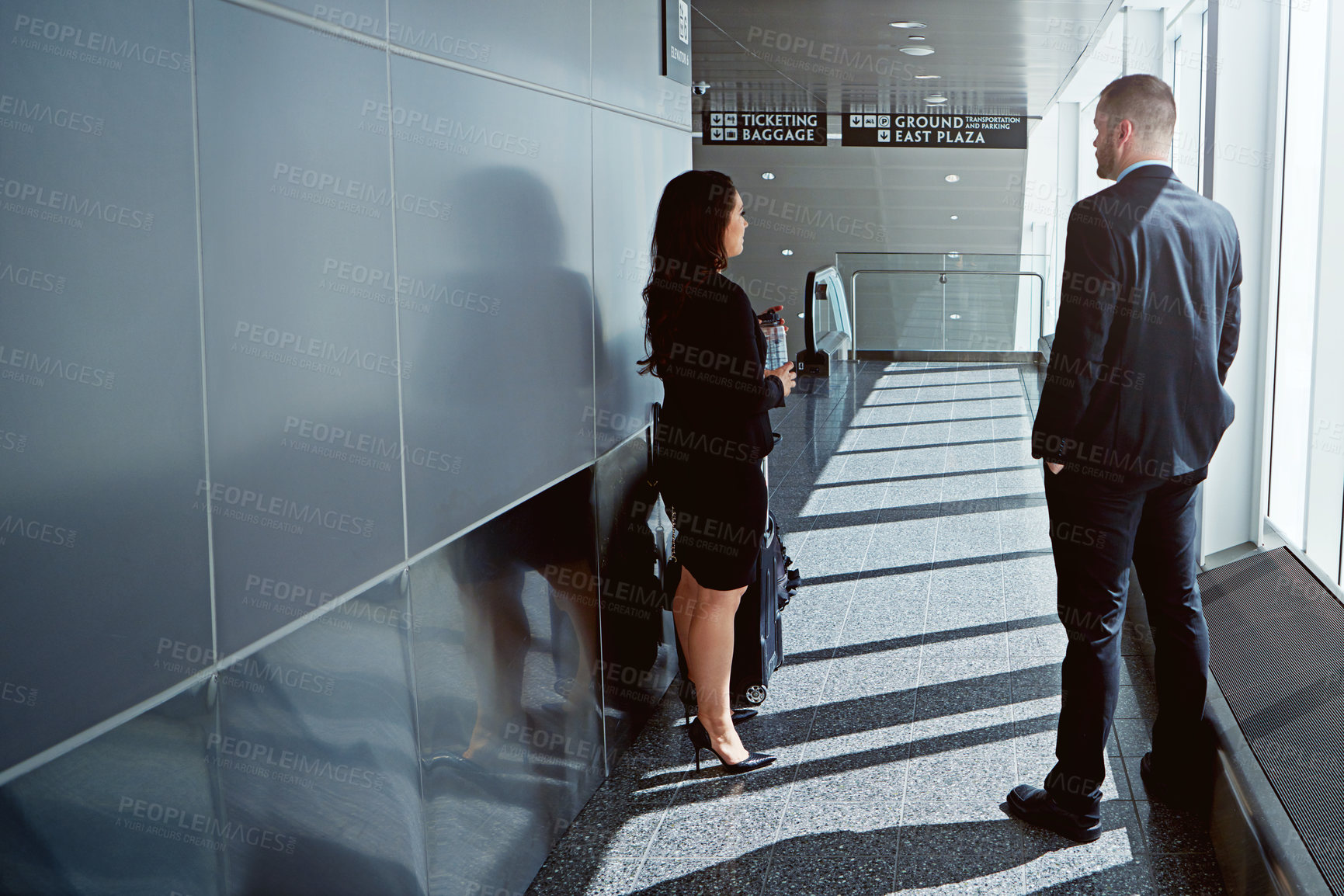 Buy stock photo Waiting room, talking or business people in airport with suitcase, luggage or baggage on a trip together. Travel, networking or back of corporate workers in discussion to chat on international flight