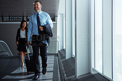 Buy stock photo Business man, woman and suitcase for walking at airport, thinking or vision on international travel. Professional people, luggage or happy in corridor, idea or flight for global immigration in London