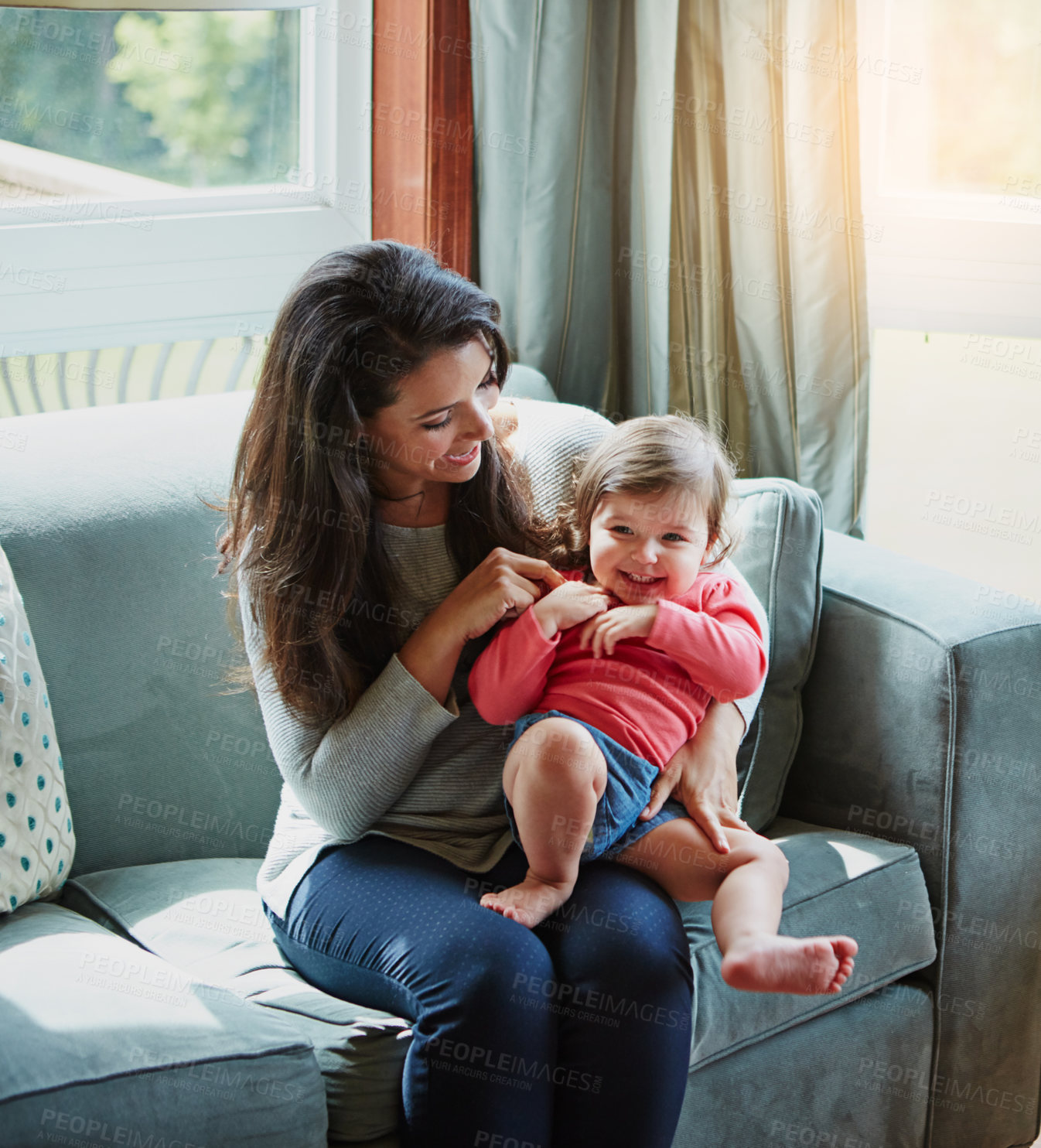 Buy stock photo Mother, daughter and playing or happy in home with relax, bonding and love with embrace or fun together. Family, woman and child or kid with smile for trust, care and security in living room of house