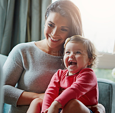 Buy stock photo Relax, happy and laughing with mother and baby on sofa for bonding, quality time and child development. Growth, support and funny with mom and daughter in family home for health, connection and care