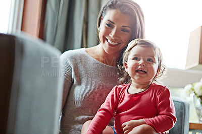 Buy stock photo Family, children or love with a mother and girl together in the living room of their home, sitting on a sofa. Mama, baby and house with a woman and child daughter bonding on the couch in their lounge