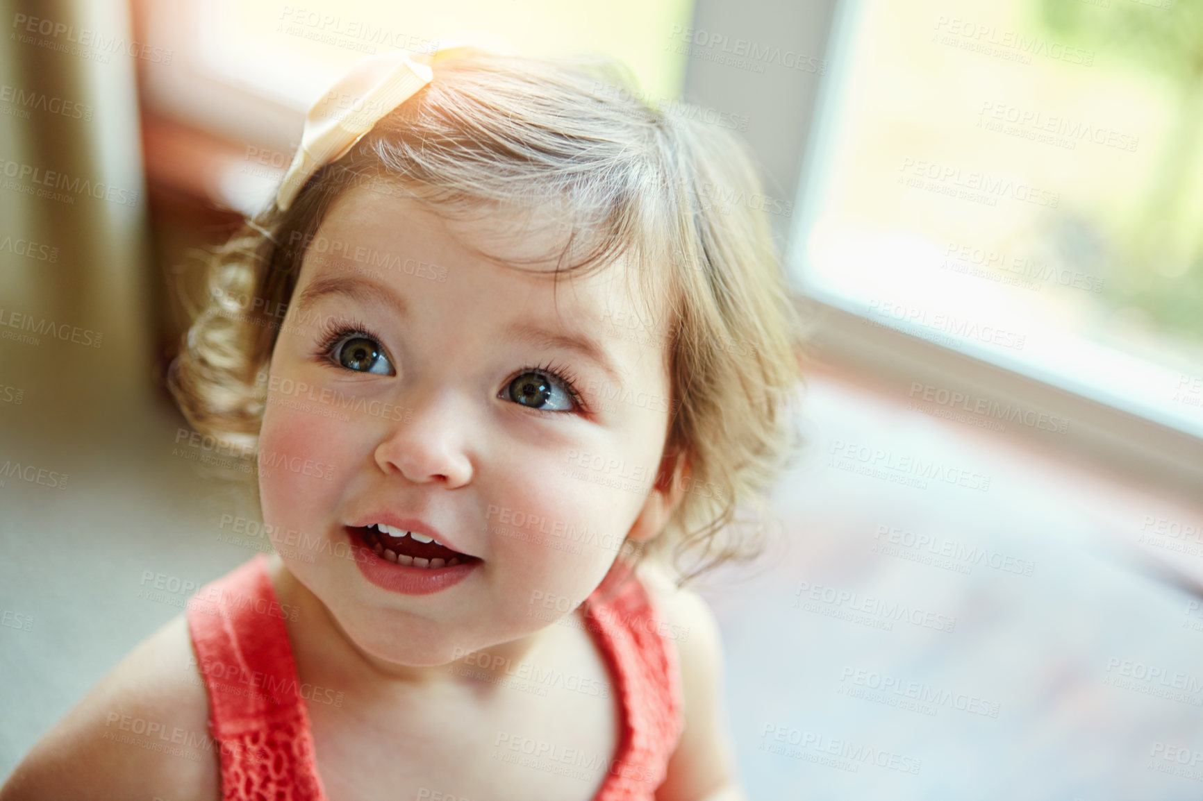 Buy stock photo Happy, girl and toddler with thinking in home for cheerful, fun and child development on weekend. Relax, baby and curious with wonder in house for innocent positivity, joy or childhood in morning