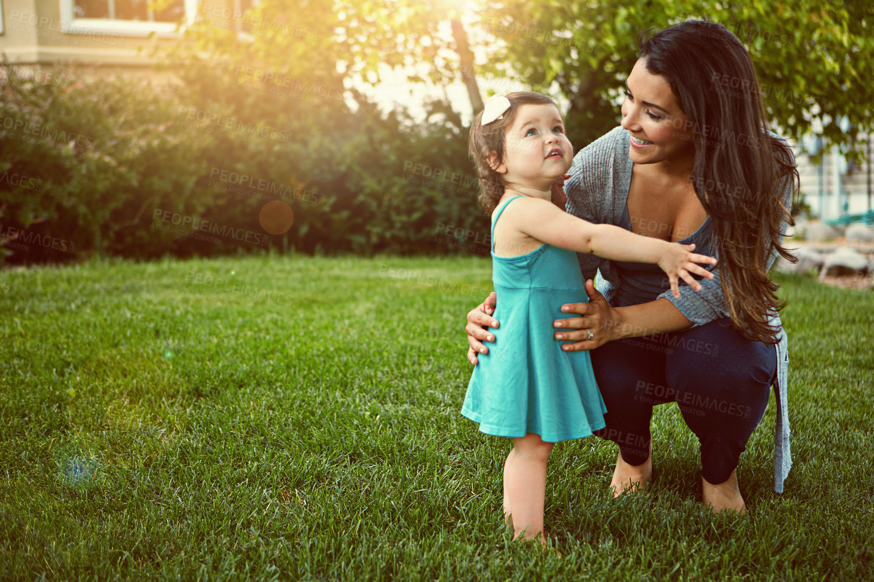 Buy stock photo Shot of a mother bonding with her adorable little daughter outside