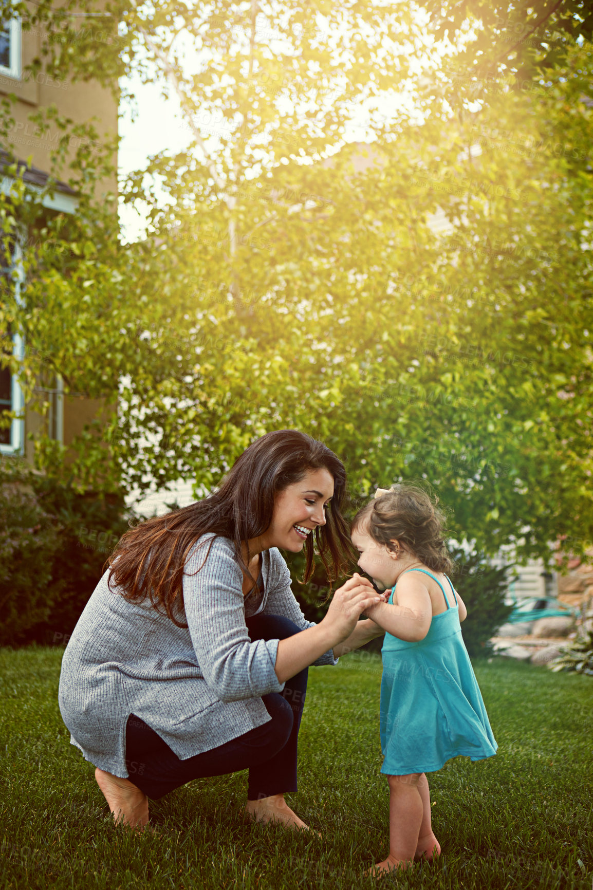 Buy stock photo Shot of a mother bonding with her adorable little daughter outside