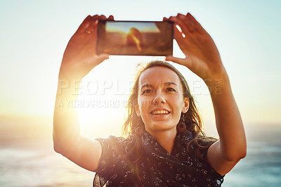 Buy stock photo Selfie, nature and woman with smart phone or enjoying ocean or relaxed face for vacation in summer or excited on bokeh. Face, female person and taking picture or holiday fun or blue sky and sea