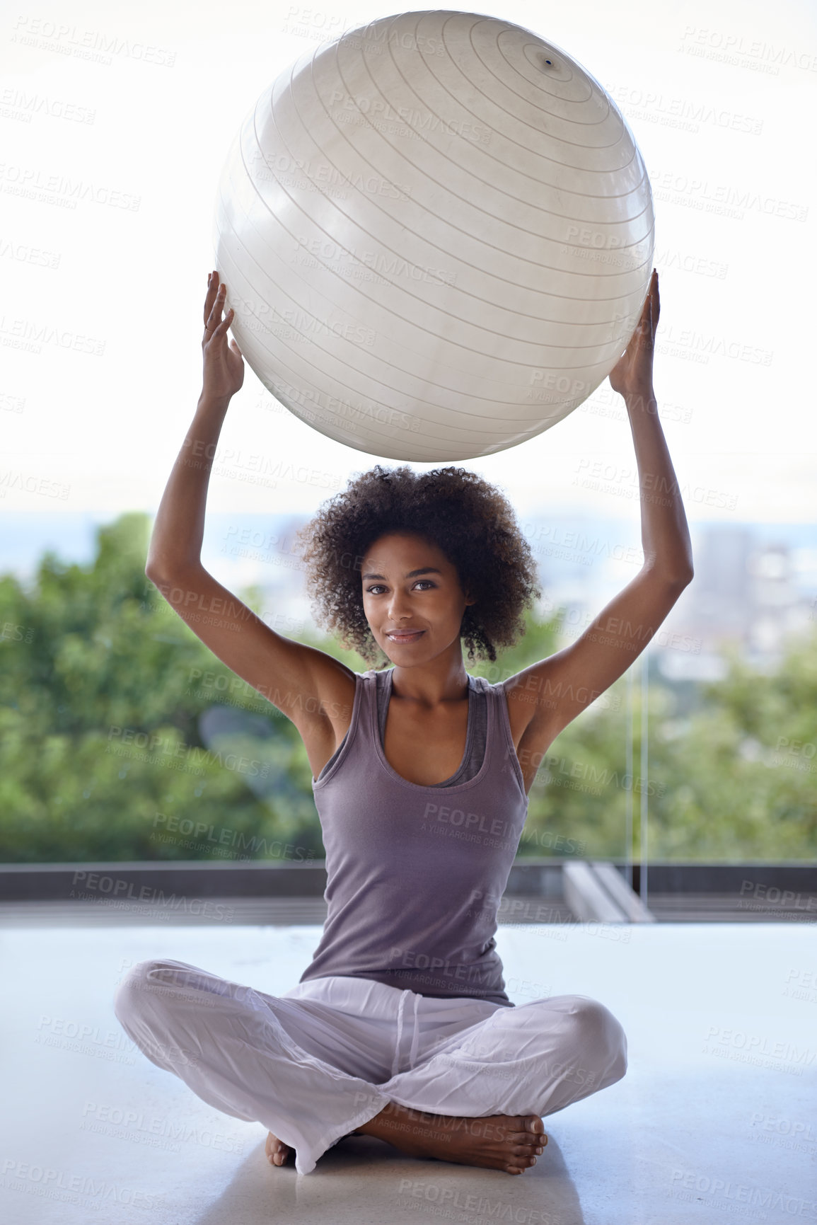Buy stock photo Woman, portrait and balance ball for fitness and wellness in studio with exercise and health on the floor. Happy African person with workout, pilates and holding arms up for power, strength and body