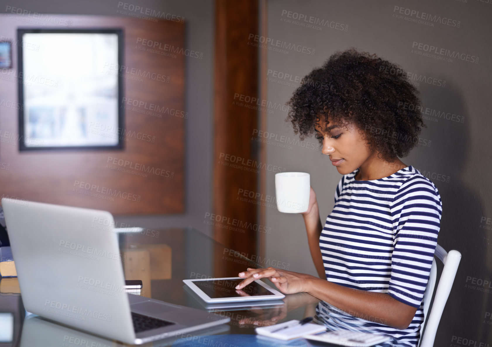 Buy stock photo Laptop, tablet and woman with coffee for work from home opportunity, freelancer career and multimedia planning. African person or remote worker drinking tea with inspiration for digital tech project
