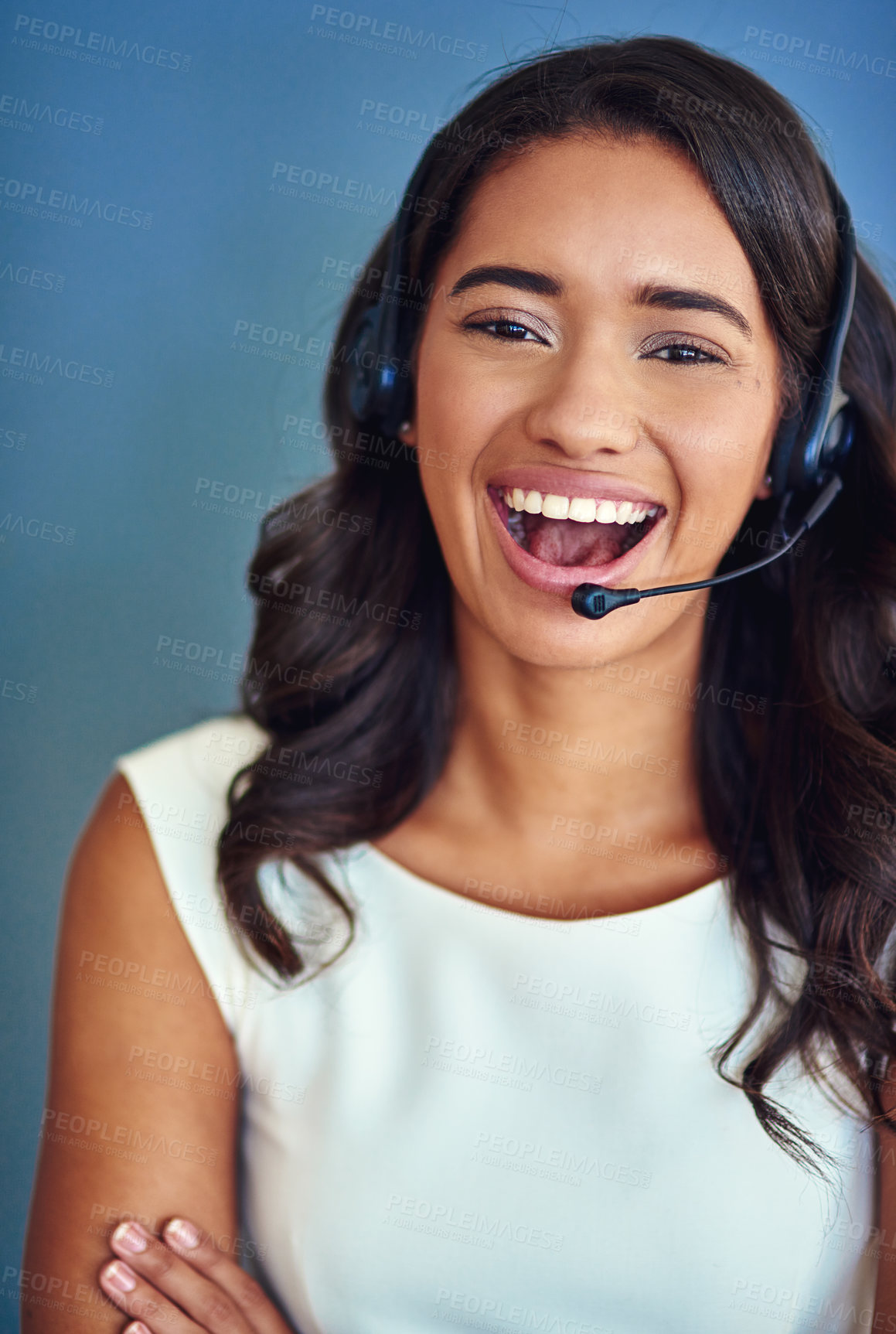 Buy stock photo Call center, portrait and businesswoman in studio with laugh, telemarketing and customer service. Confidence, female agent and headset for listening, hearing and support for faq by blue background