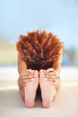 Buy stock photo Shot of a young woman practicing her yoga routine