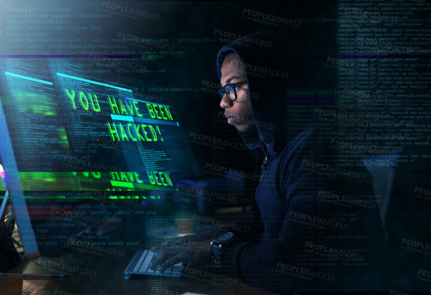 Buy stock photo Cropped shot of a young man hacking into a secure computer network
