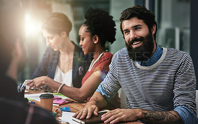 Buy stock photo Shot of a group of designers having a discussion in an office