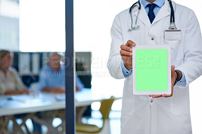 Buy stock photo Cropped shot of a doctor holding a digital tablet with a chroma key screen