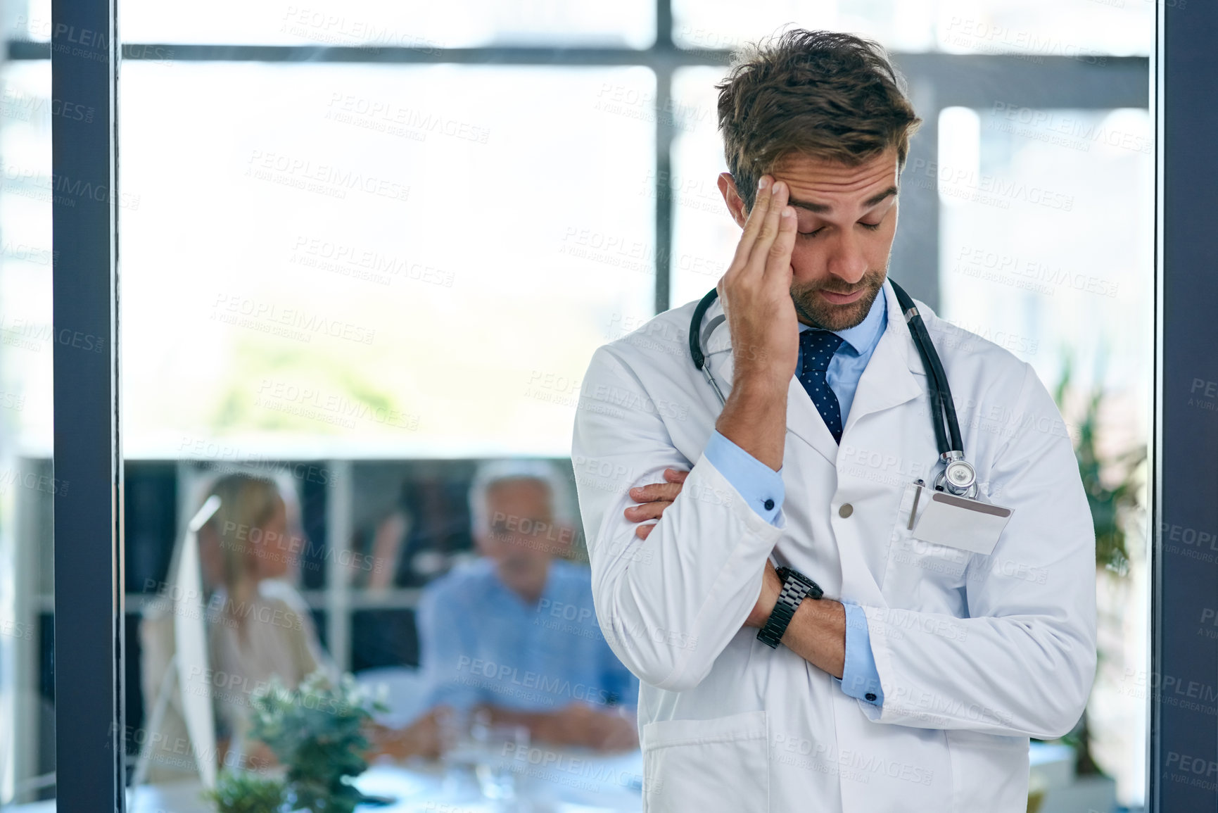 Buy stock photo Hospital, doctor and man with headache, stress and worry for medical career, job and work with patients. Professional, healthcare and person with pain for overworked, burnout and frustrated in clinic