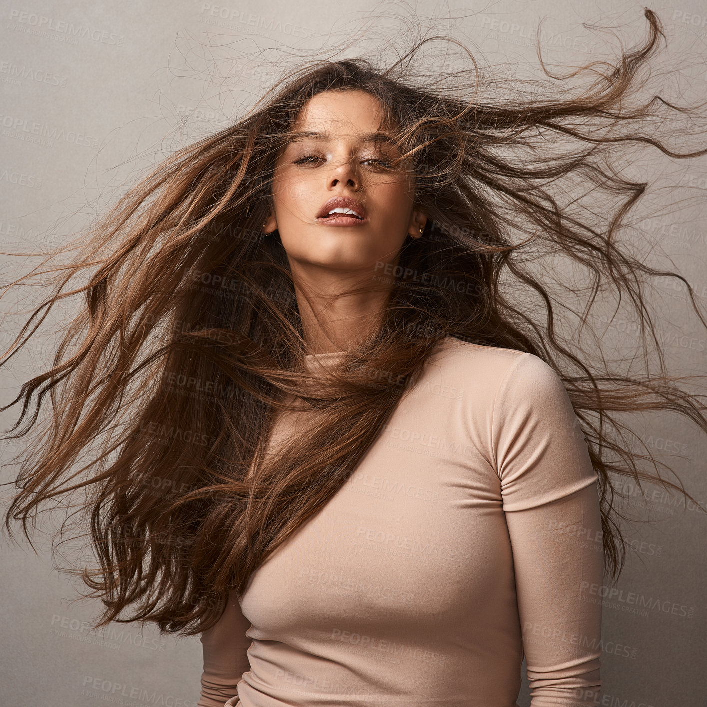 Buy stock photo Wind, hair care and portrait of girl for natural growth, cosmetics results and confidence in studio. Flow, breeze and face of proud model woman on grey background for conditioner, texture and beauty