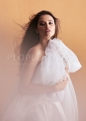 Buy stock photo Portrait of a beautiful young woman posing with a ballet skirt in studio