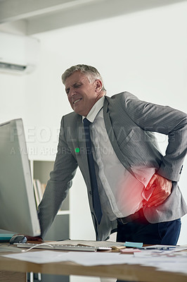 Buy stock photo Shot of a businesswoman grimacing while holding a sore spot on his back in the office