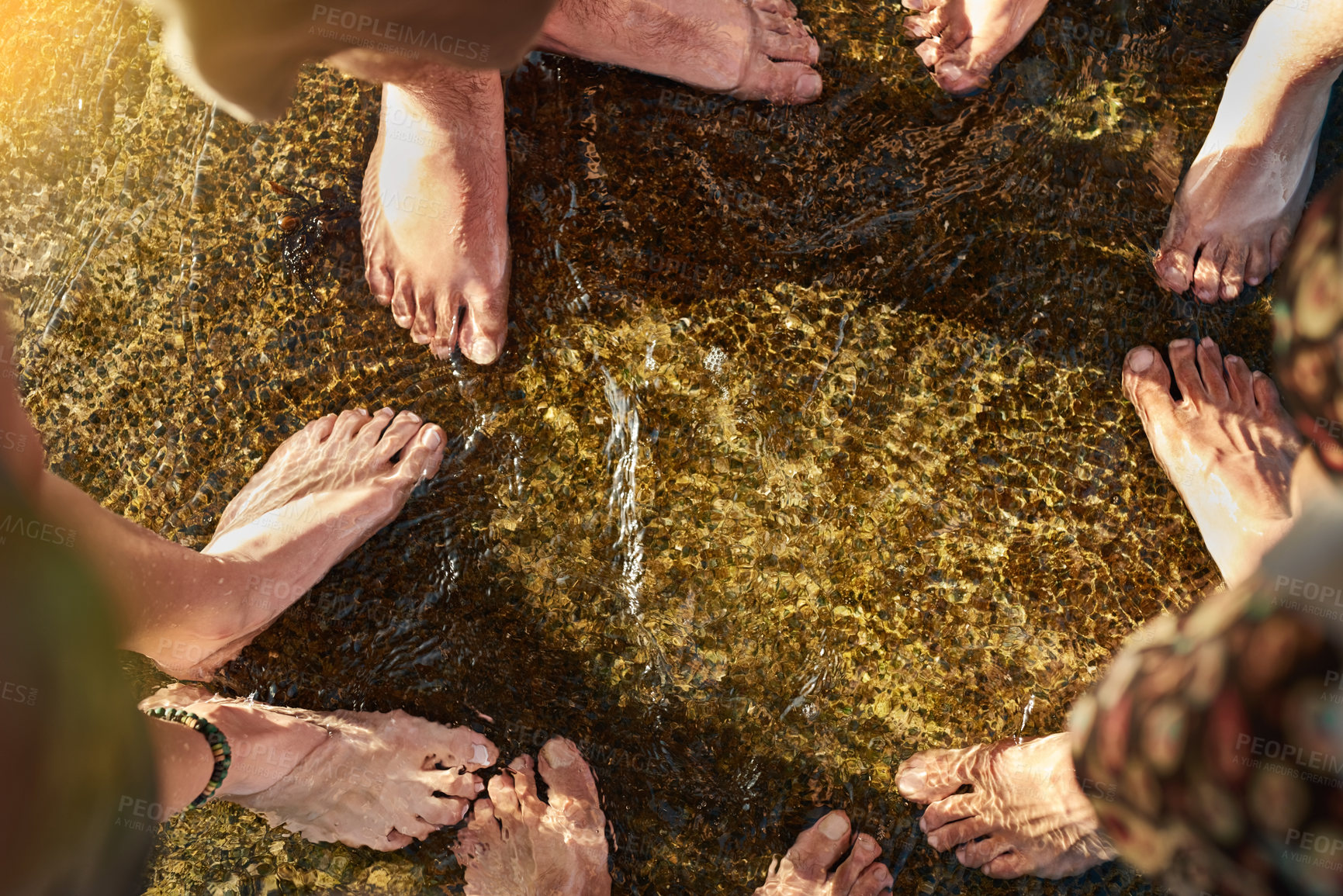 Buy stock photo Group, feet and water in stream, outdoor and friends in nature for hiking, barefoot and adventure. People, river and together for journey, break and relax in environment, holiday and vacation