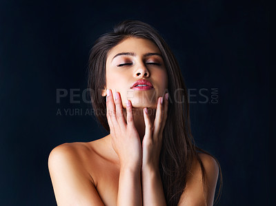 Buy stock photo Studio, beauty and model with touch, natural skincare and glow or treatment on black background. Cosmetics, omega 3 and woman with dermatology, collagen and self care satisfaction or confidence