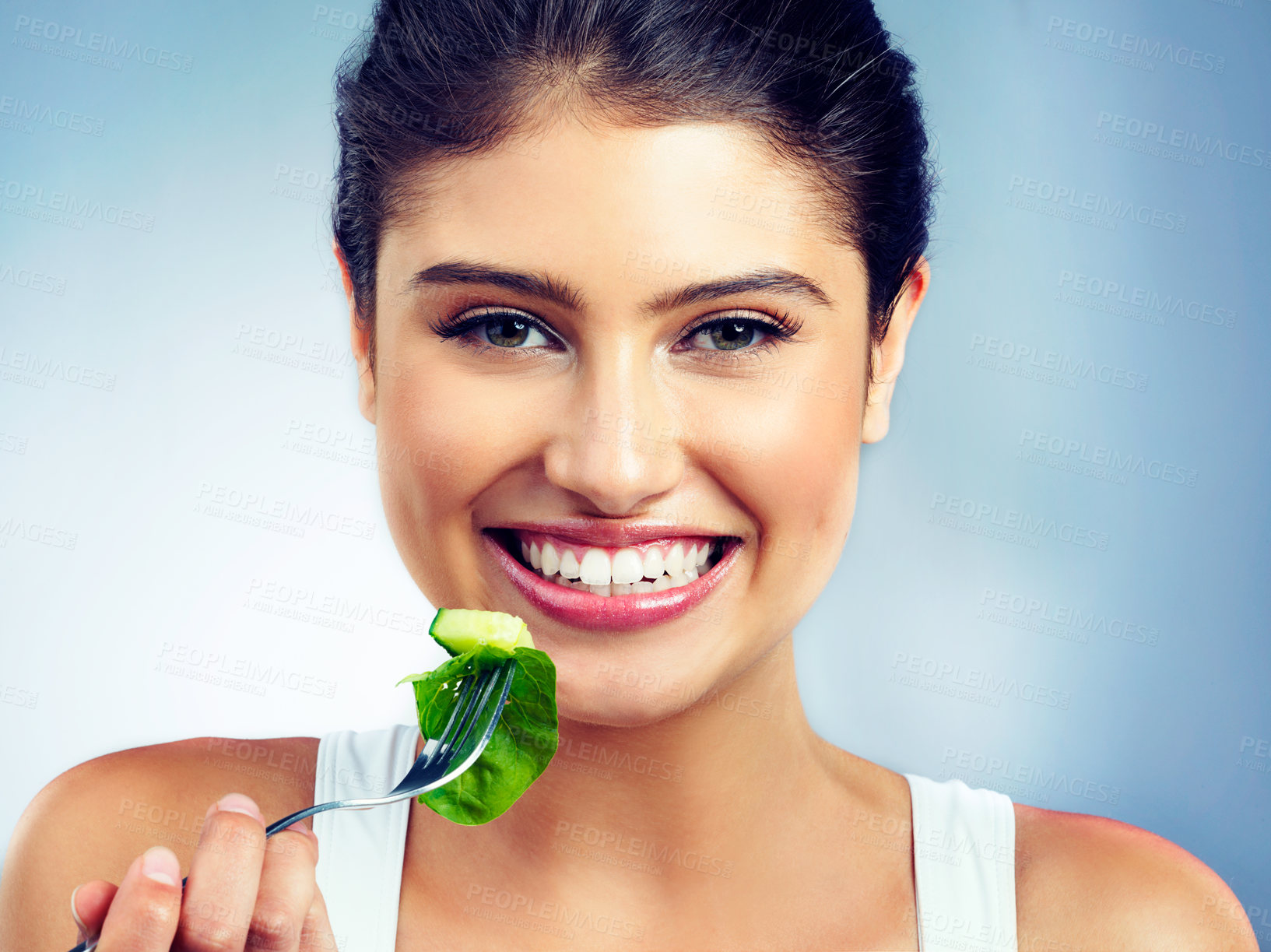 Buy stock photo Woman, portrait and happy, salad and vegetable for health and nutritionist in isolated blue background. Vegan, face and wellness, diet with female model in studio and organic food for self care