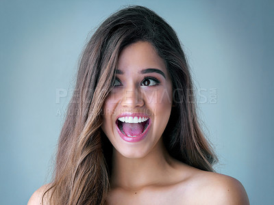 Buy stock photo Happy woman, surprise and beauty with makeup for offer, deal or crazy haircare on a blue studio background. Excited, attractive female person or young model with cosmetics in wow for glow up or shine