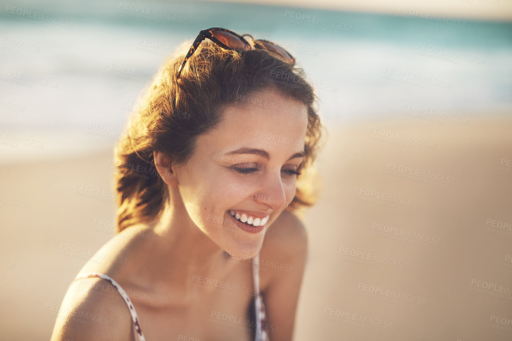 Buy stock photo Woman, laughing and smile at beach on vacation, water and travel to Bali for holiday at sea. Female person, peace and waves on trip in outdoor nature, tropical island and tourist relax by ocean